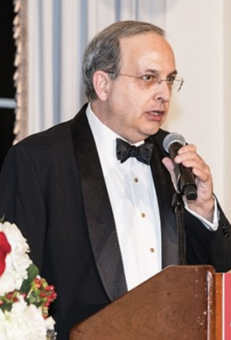 Michael Coneys, Chairman and President of The Leo House