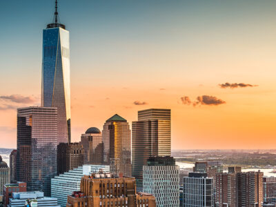 NYC in November 2021 - Image features a view of a winter sky or Manhattan during Sunset.